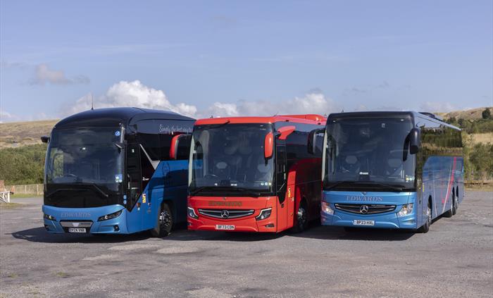 Three coaches parked side by side